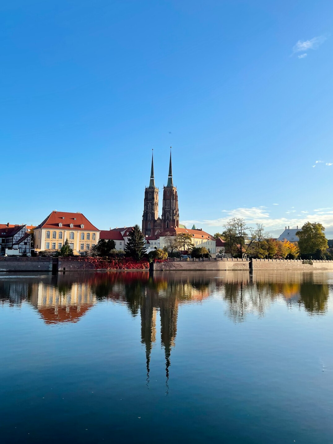 Wroclaw Cathedral Island with gothic cathedral towers reflected in the Odra river